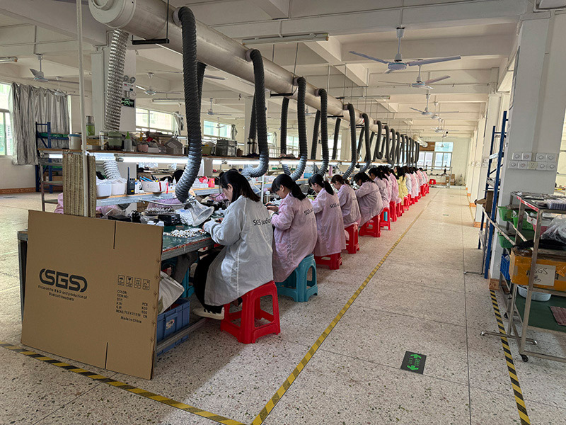 In the workshop of Simifly Electronics Co., Ltd. factory, workers wearing uniforms with SGS brand logo are working